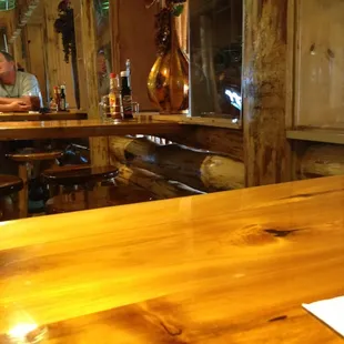 a man sitting at a table in a restaurant