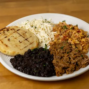 Venezuelan breakfast ( black beens, scrambled eggs, cheese and arepa)