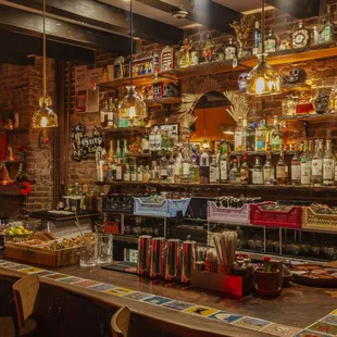 Our bar is inlayed with Loteria tiles from Mexico.