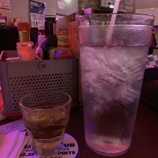 a cold drink with ice in a glass