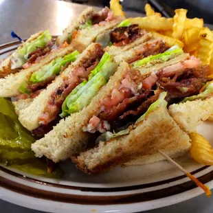 a club sandwich with pickles