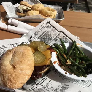 Detroit Impossible burger with garlic green beans and mushroom Swiss burger with onion rings