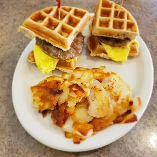 a waffle sandwich with bacon and eggs