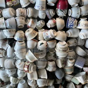 a wall of tea cups