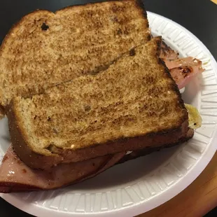 a sandwich on a paper plate