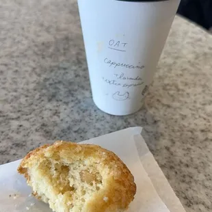 White chocolate macadamia nut muffin(made fresh in house) and an oat-milk cappuccino with an extra shot of espresso and lavender.
