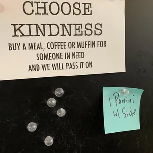 a sign that says choose kindness buy a meal, coffee or muffin for someone in need and we will pass