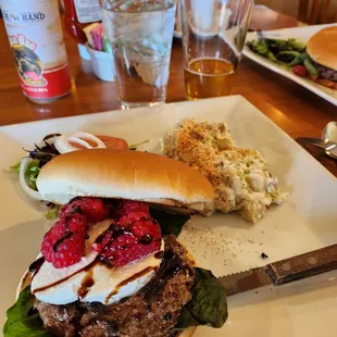 Chef's monthly feature- basil leaves, mozzarella,  raspberries with balsamic drizzle.