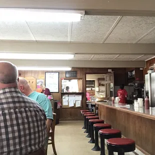 a man sitting at the counter