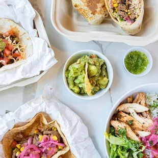 a variety of tacos and salads