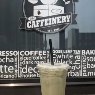 a hand holding a cup of coffee