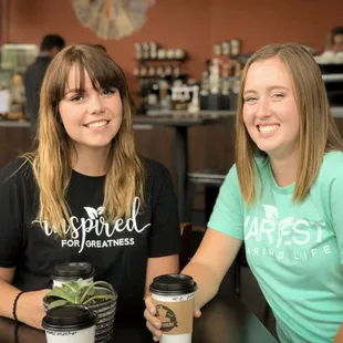 two women sitting at a table