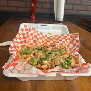 Cajun fries comes with your choice of chicken, crawfish, shrimp or sausage