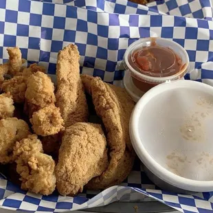 Fried oysters, fried catfish, hush puppies and dirty rice! Very good portions even though they look small in this picture!