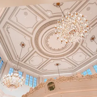 Chandeliers and gorgeous ornate crown molding