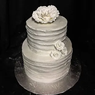 a three tiered white wedding cake