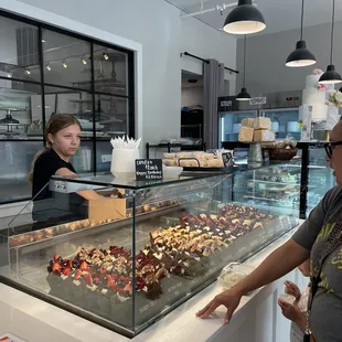 a woman standing in front of the counter