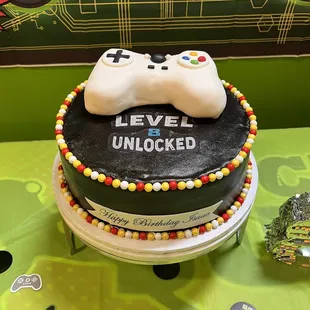 a cake with a video game controller on top