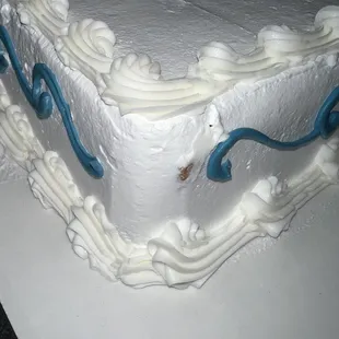 Cake exposed through frosting.