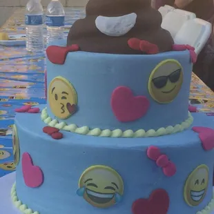 a cake with emoticions on it