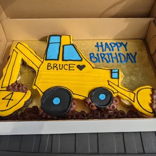 a construction vehicle shaped cake