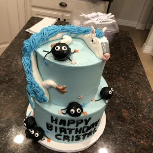 a birthday cake with a character on it