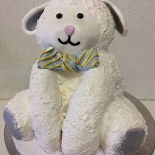 a white lamb with a bow tie