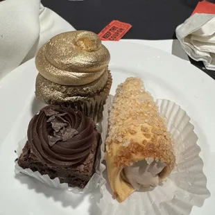 Chocolate cupcake painted gold (for our theme), chocolate filled cream horn and brownie bite.