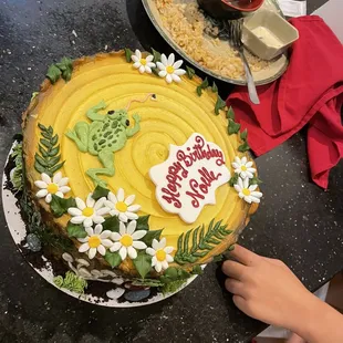 someone decorating a cake
