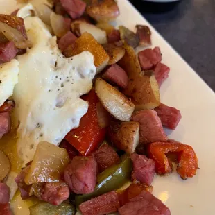 a plate of food with meat and vegetables