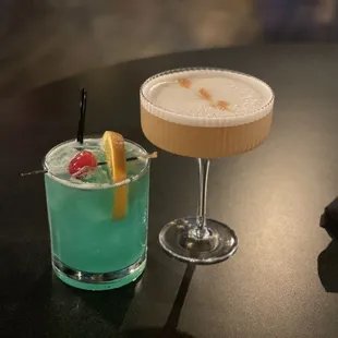 two cocktails on a table