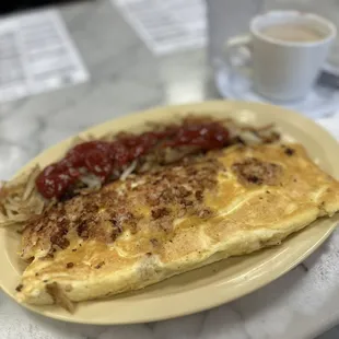 3 egg omelet and hash browns  with coffee . Delicious and enough for 2 .