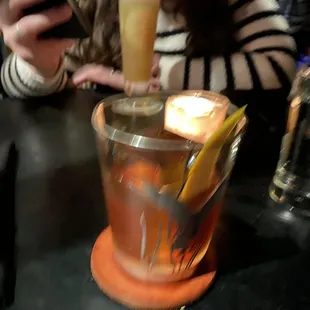 A blurry picture of my Orange Negroni in the cute bird-themed glass