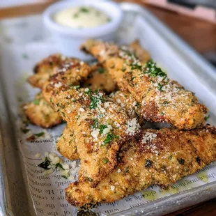 April 21, 2024; Chicken Goujons with Black Truffle Aioli ($13).
