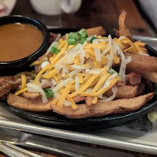 February 22, 2025; Cheesy Curry Chips ($12).