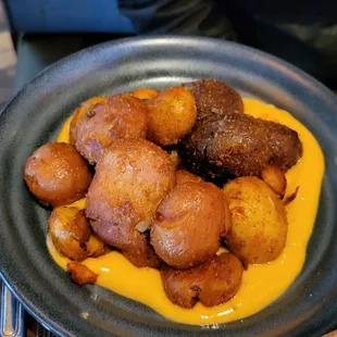 Papas Bravas - whole roasted seasoned baby potatoes with a mild spicy aioli. Great!