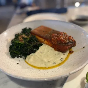 Salmon Main Entree that includes a creamy polenta and broccolini