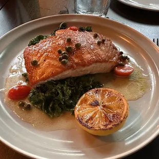 Lemon butter caper salmon with sautéed kale