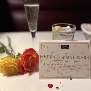 Roses, champagne and card from Capital Grille