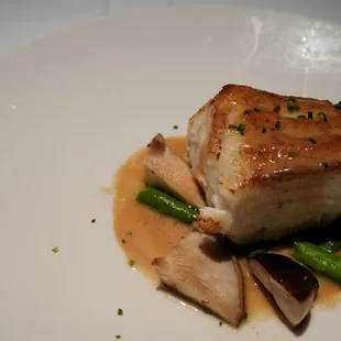 Pan-Seared Sea Bass with Shiitake Mushrooms, Asparagus and Miso Butter ($55).