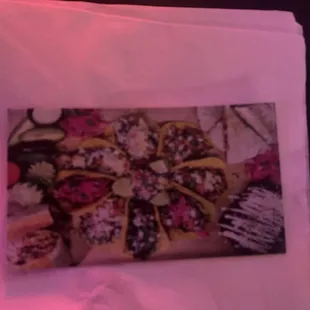 Pic of diff tacos they make in the back if their business card