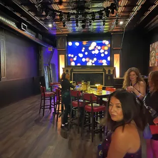 a group of people sitting around a table