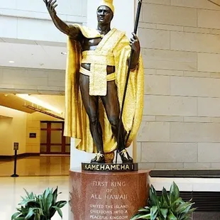 a statue of a man with a staff