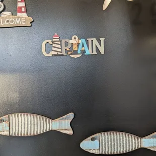 two fish and a lighthouse