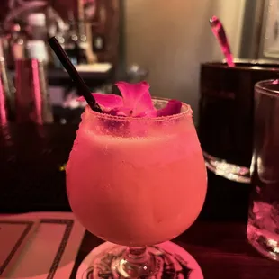 a pink drink in a glass