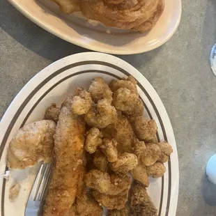 3 item combo-whitefish shrimp and scallops up charged w onion rings and hush puppies