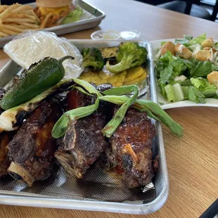 Ribs grilled veggies and a cesar salad