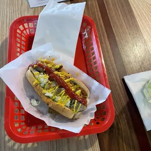 a hot dog with mustard and ketchup