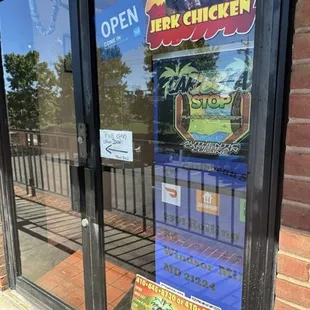 The front of the restaurant. The second picture is jerk chicken meal and I got a Kola.