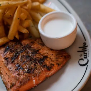 Grilled salmon with french fries at The Carlile in Downtown Seattle